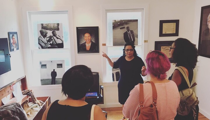 Group stands looking at art