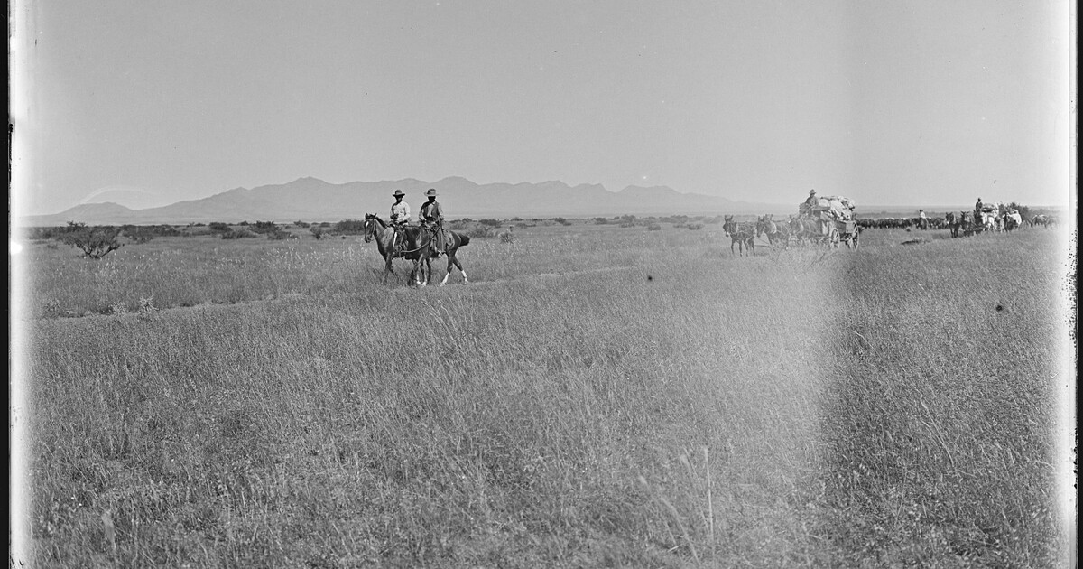 The Greene Cattle Company chuck wagons following a couple of the